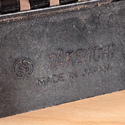 Close-up of Takeuchi Made in Japan stamp on tremolo block
