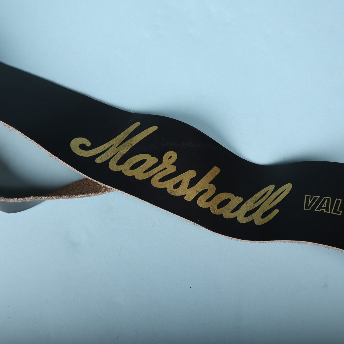 Detailed view of the gold Marshall logo lettering across the strap body