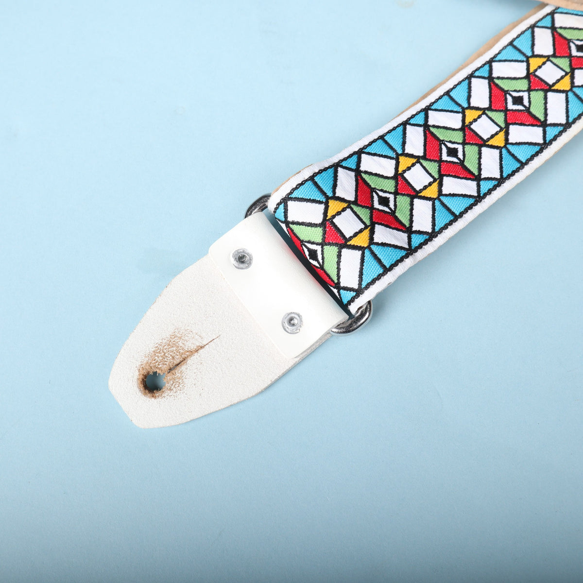 Close-up view of the opposing white leather tab and metal ring loop on the Authentic Hendrix strap