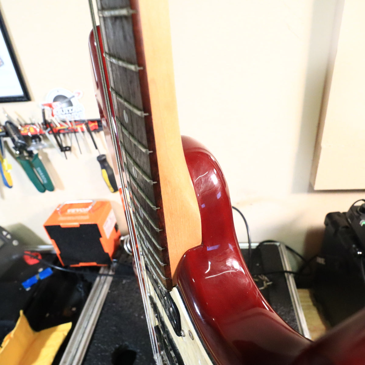 Perspective view along fretboard edge toward body and pickguard.