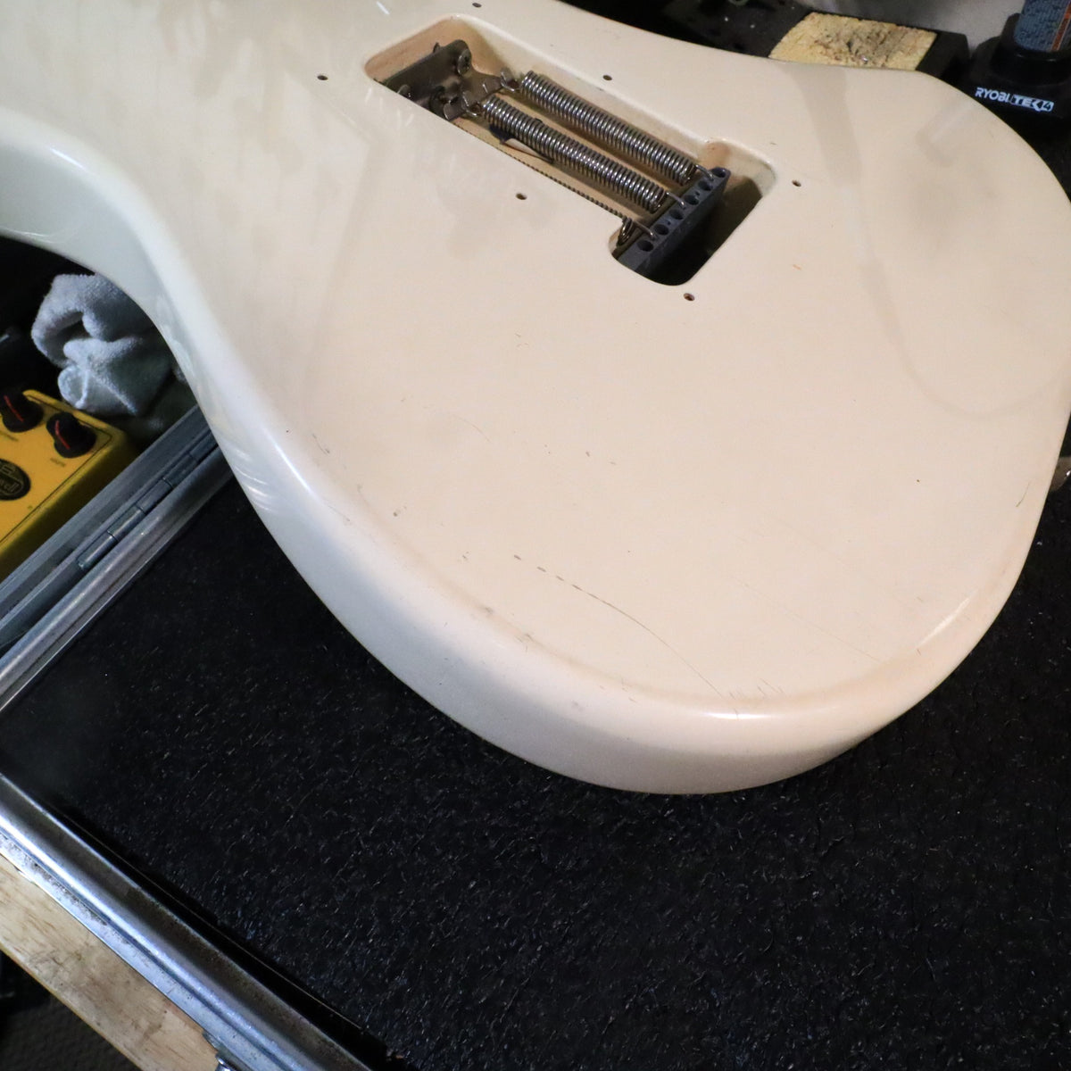 Back of guitar body showing open tremolo cavity and springs