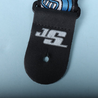 Close-up of the black leather strap end tab stamped with the silver JS logo