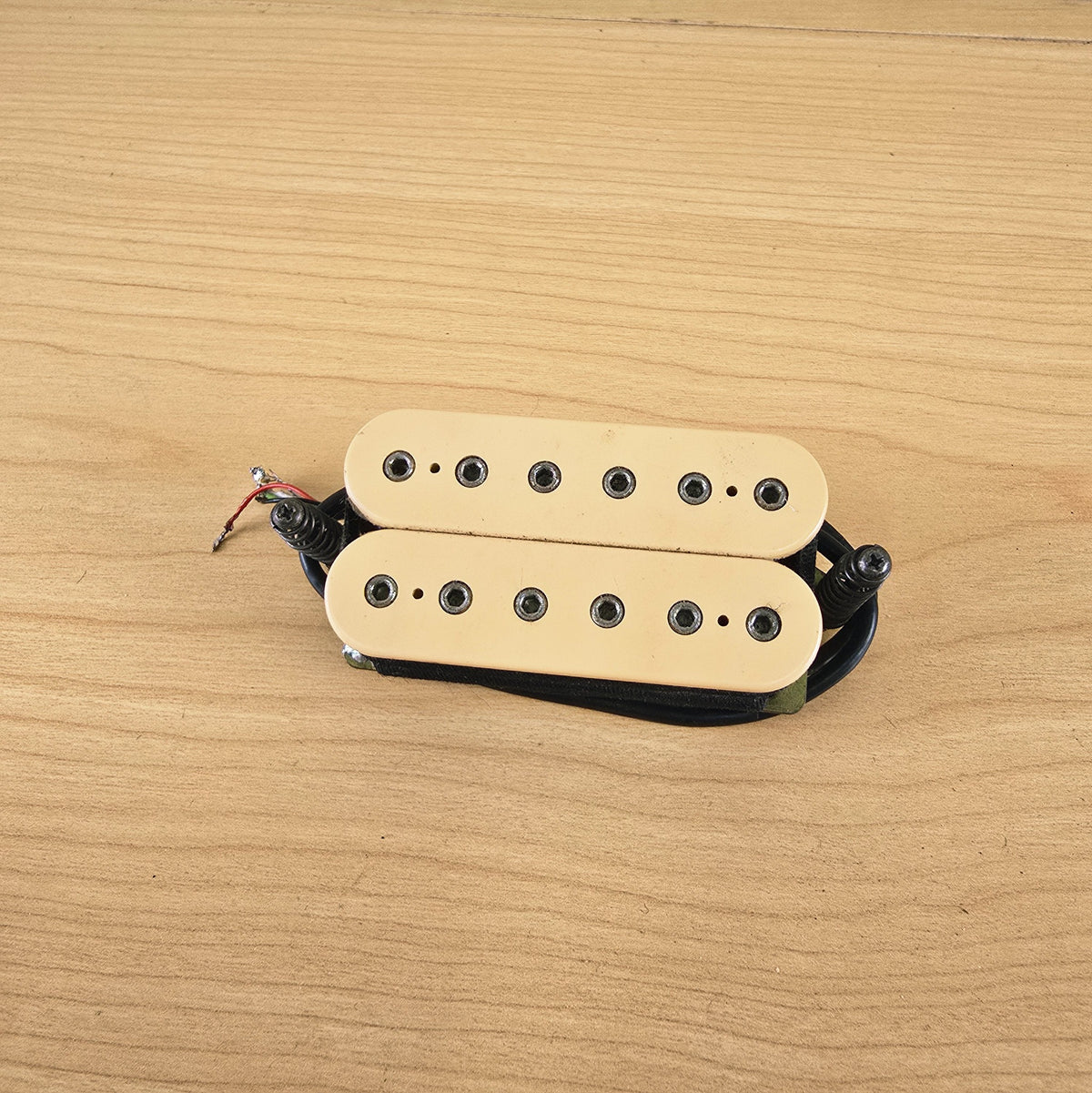 Top view of cream DiMarzio DP104 Super 2 humbucker pickup with hex pole pieces