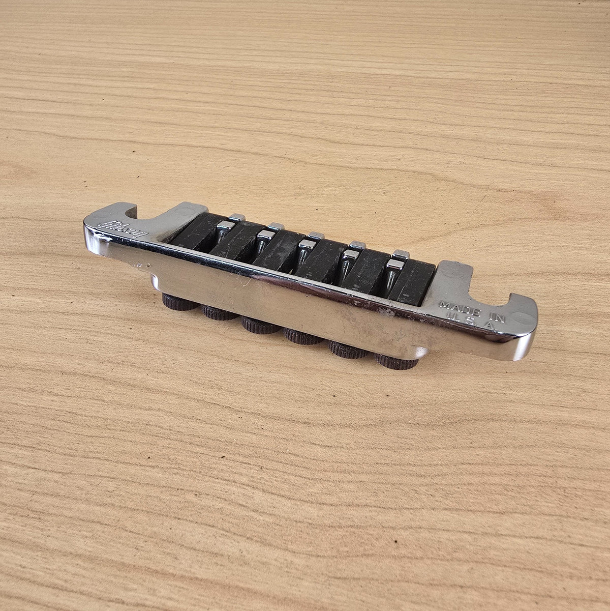 Side profile view highlighting the chrome plating and individual fine-tuning thumbscrews