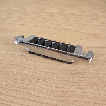 Side profile view highlighting the chrome plating and individual fine-tuning thumbscrews