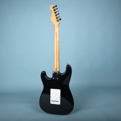 Full rear view of the guitar on stand
