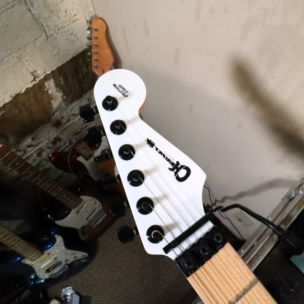 Side profile showing Seymour Duncan white humbucker pickups and black pickguard.