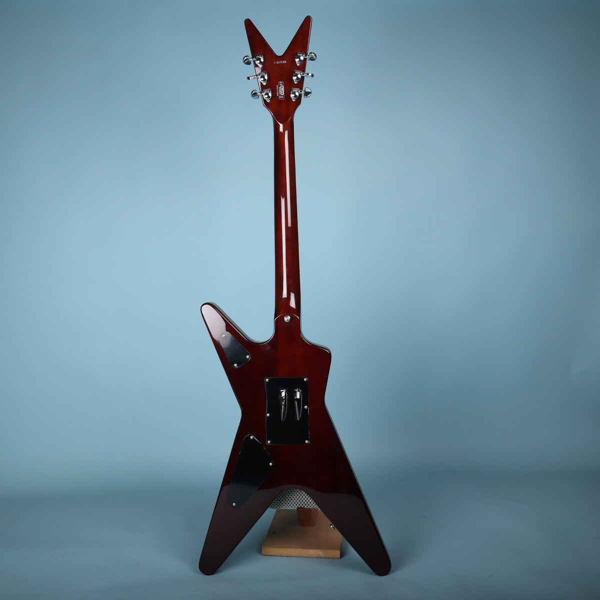 Full rear view of Dean ML electric guitar showing dark cherry finish and cavity covers