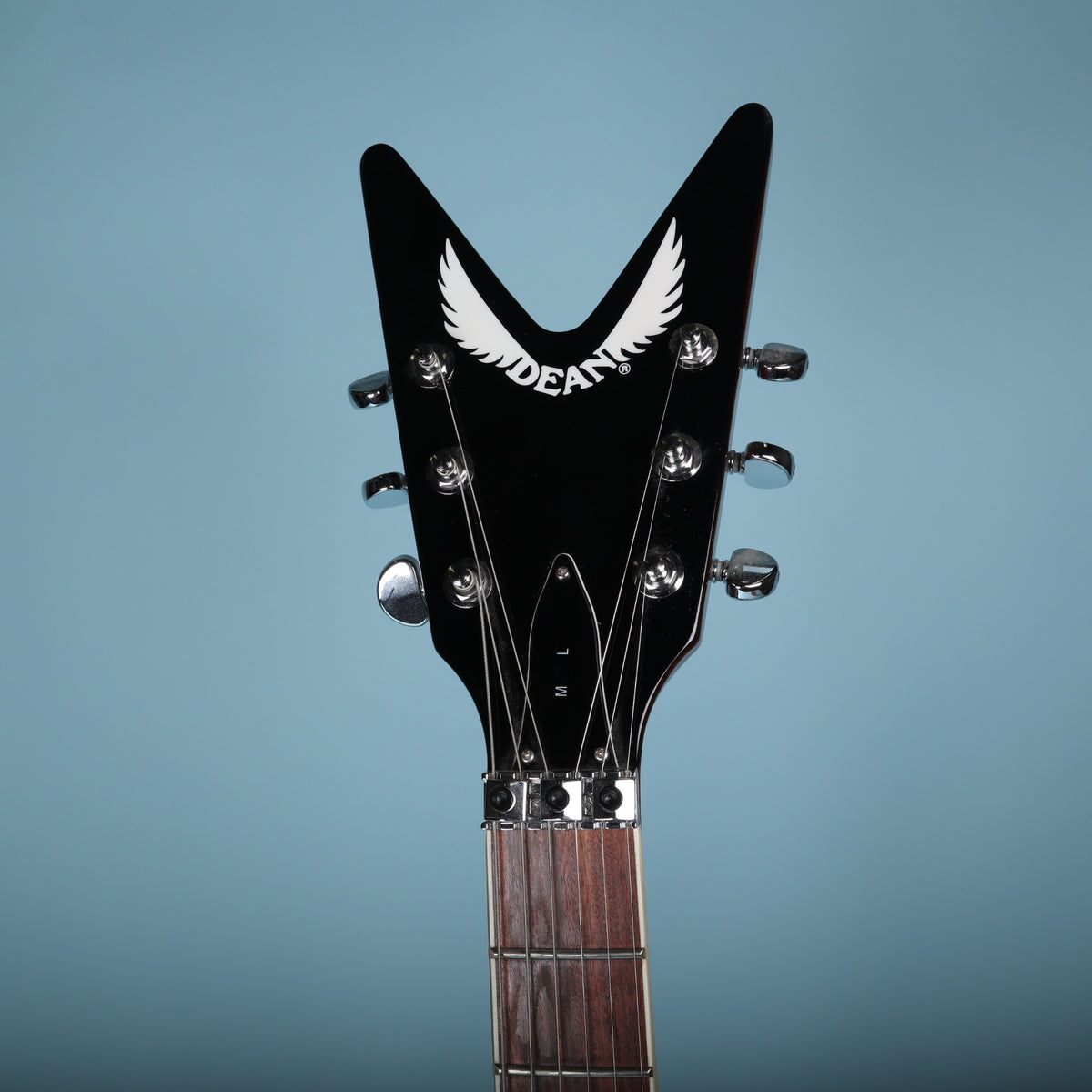 Dean ML V-shaped headstock face with white winged logo and ML truss rod cover