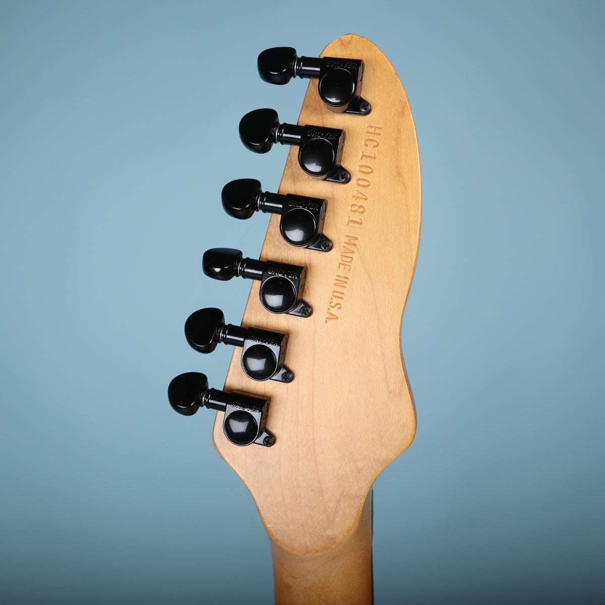 Back of the headstock showing Grover tuners and stamped serial number HC100481 Made in U.S.A.