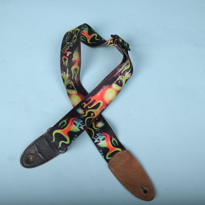 Full overhead view of the strap showcasing the flaming skull motif and suede end tab backing.