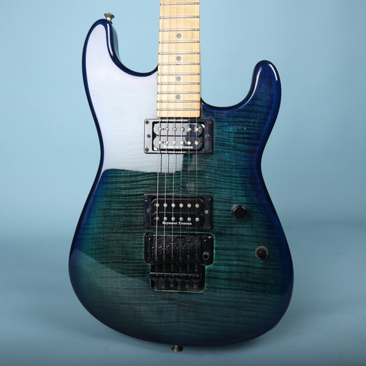 Front body view of Charvel electric guitar in trans blue burst flame