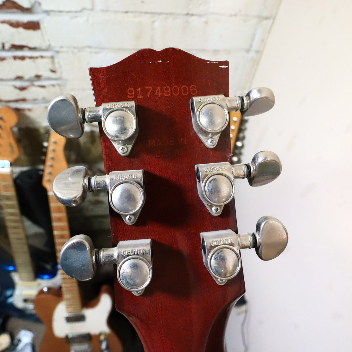 Back of the headstock showing stamped serial number 91749006, 'MADE IN U.S.A.', and chrome Grover tuners.