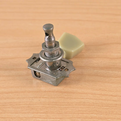 Perspective view focusing on the tuner post and washer assembly.