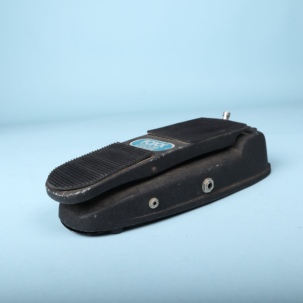 Side perspective of the black Foxx treadle pedal housing and quarter-inch jack