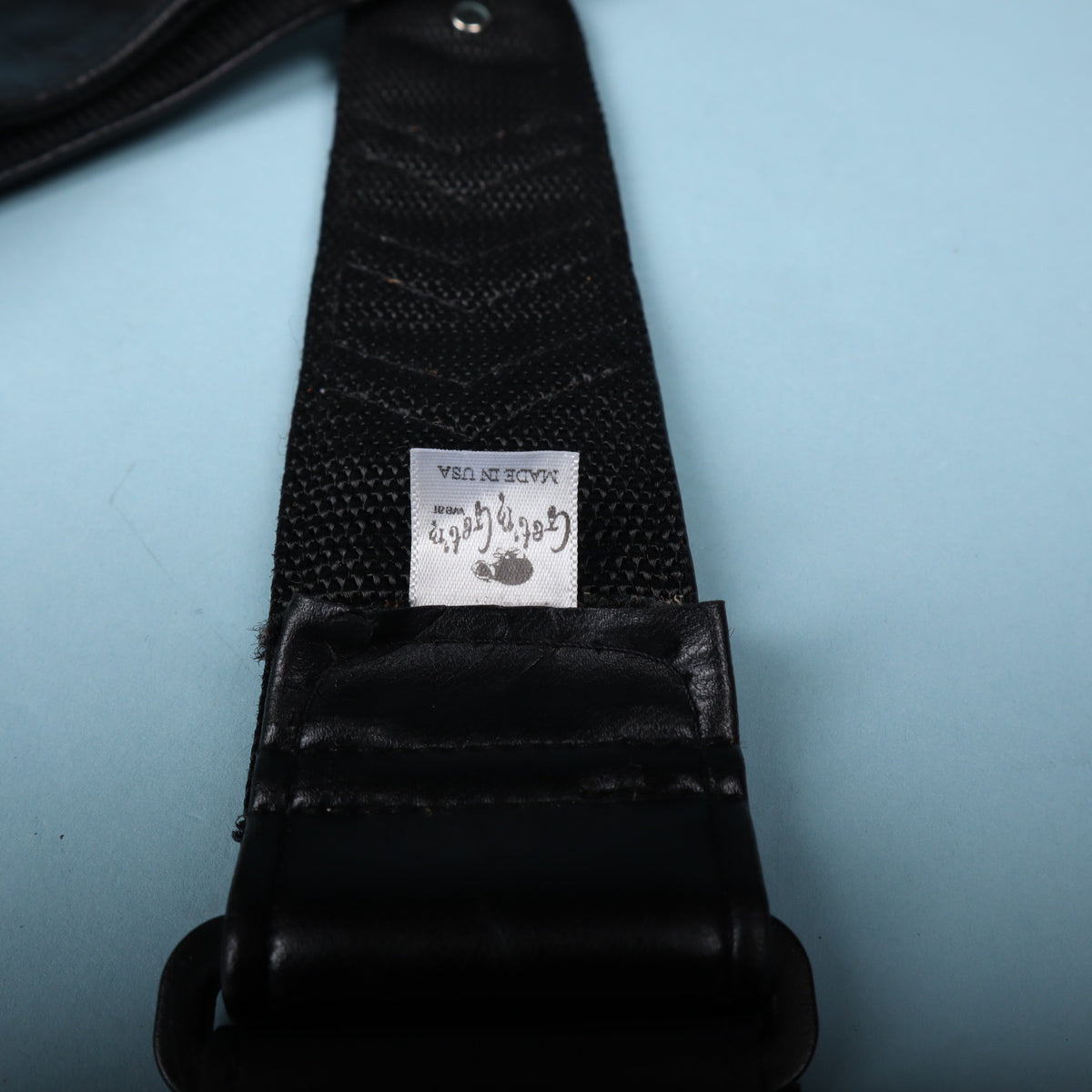 Close-up of the woven fabric tag reading Get'm Get'm Wear and Made in USA