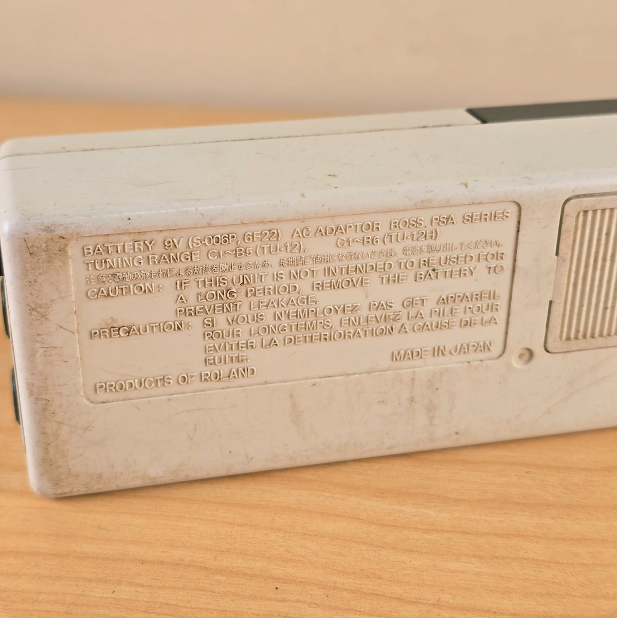 Detail of embossed technical specifications and Made in Japan lettering on rear housing.