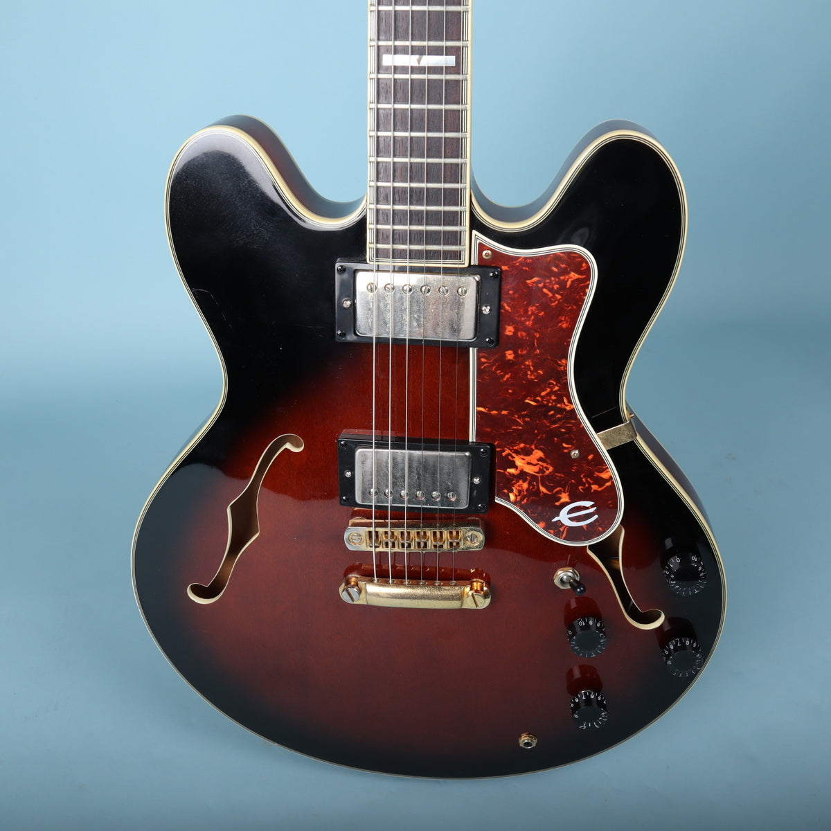 Close-up of Epiphone Sheraton body and bridge