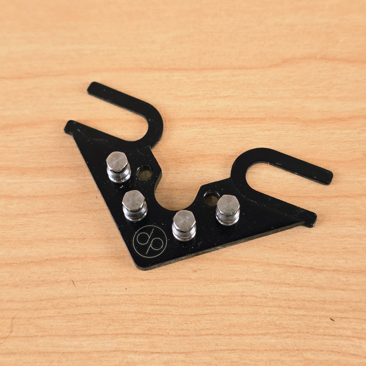 Angled top view of the Dietrich Parts String Butler V3 showing the finish and guide posts