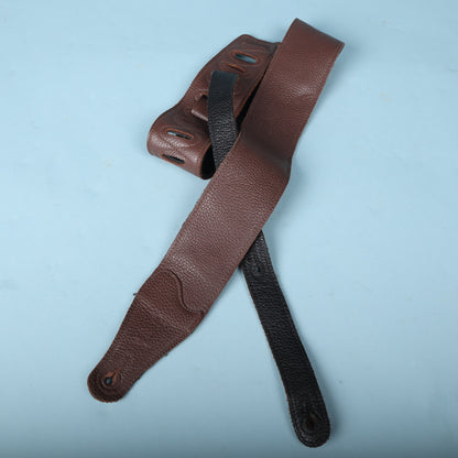 Levy's brown garment leather guitar strap showing both the brown top and black backing