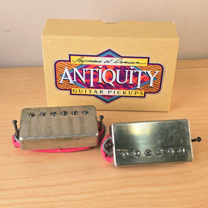 Front view of Seymour Duncan Antiquity humbucker set and box on wooden surface
