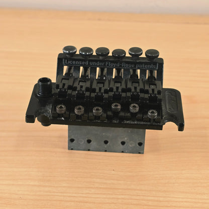 Front elevated view showing the bridge unit and attached sustain block.