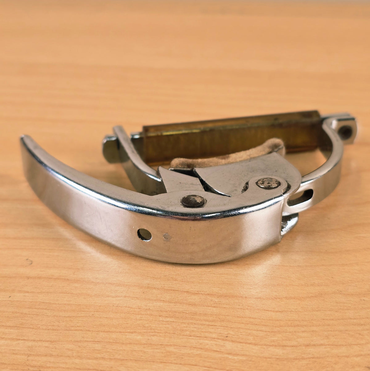 Front-angle view of the Hamilton KB19A capo displaying the hinged latch bar.