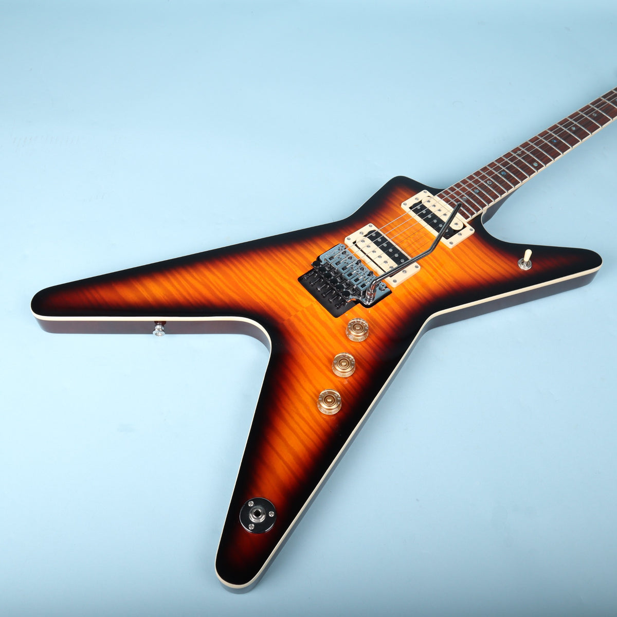 Angled top-down view of Dean ML body showing flame sunburst top and hardware
