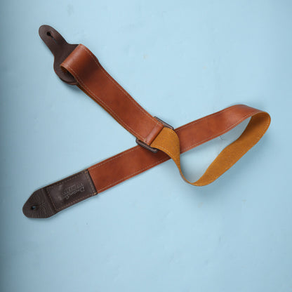 Doctor Song Pick-Pocket leather guitar strap folded over, showing the suede underside texture.