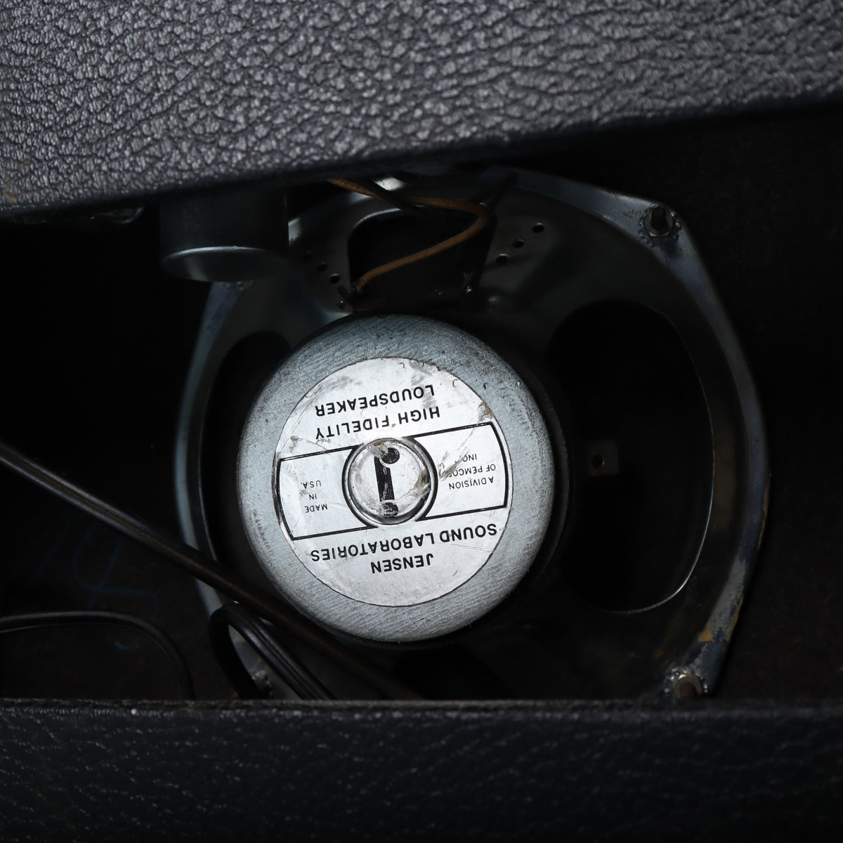 Jensen High Fidelity loudspeaker mounted inside the rear of the amplifier cabinet.