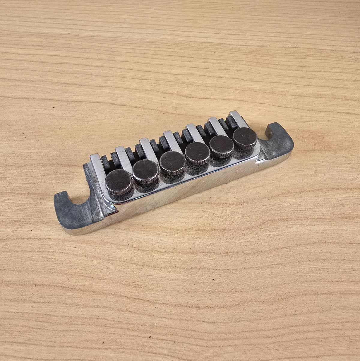 Rear angle view showing the chrome body and fine tuning screws of the TP-6 tailpiece