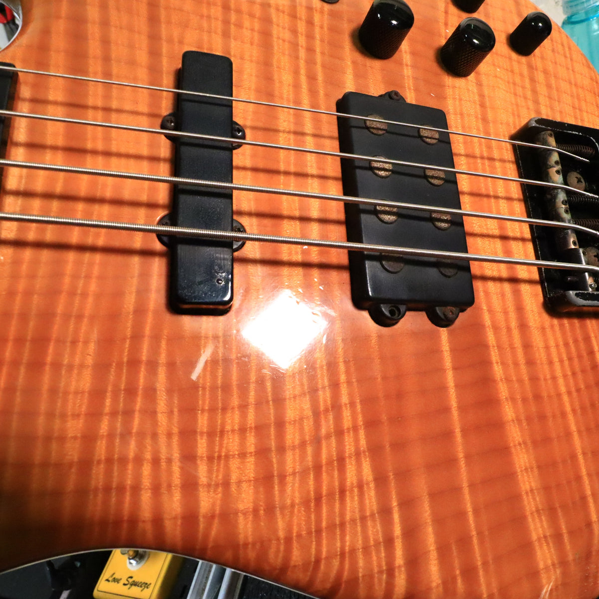 Detailed view of the J-style single coil and bridge humbucker pickups.