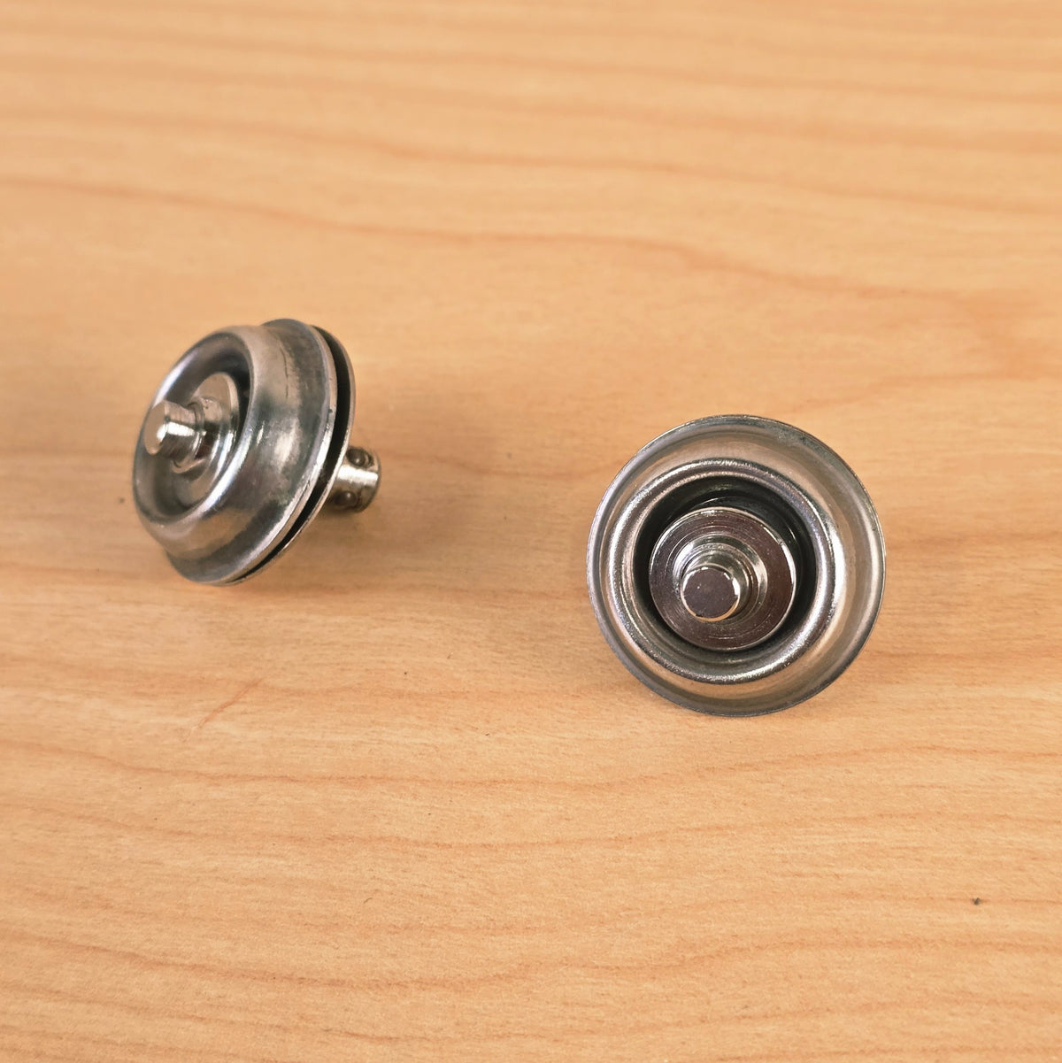 Angled view showing the spring-loaded ball bearings on the post of the Jim Dunlop Straplok.