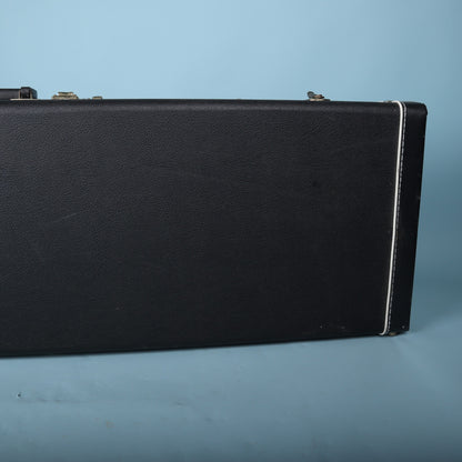 Tobias hardshell bass guitar case side profile showing black exterior and white piping
