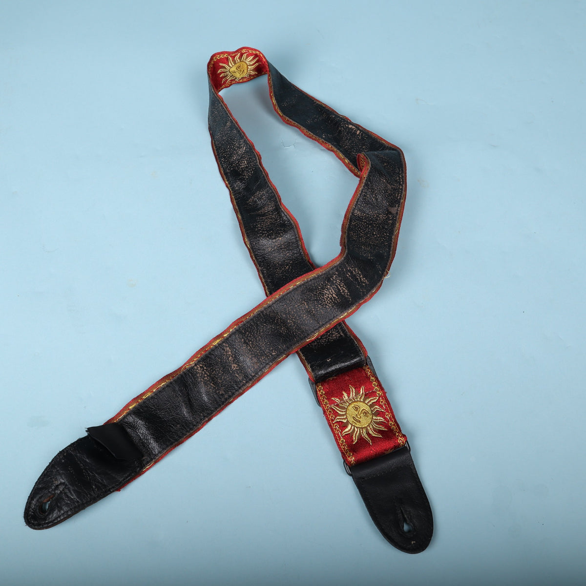 Full view of the strap underside displaying heavy finish wear on the backing