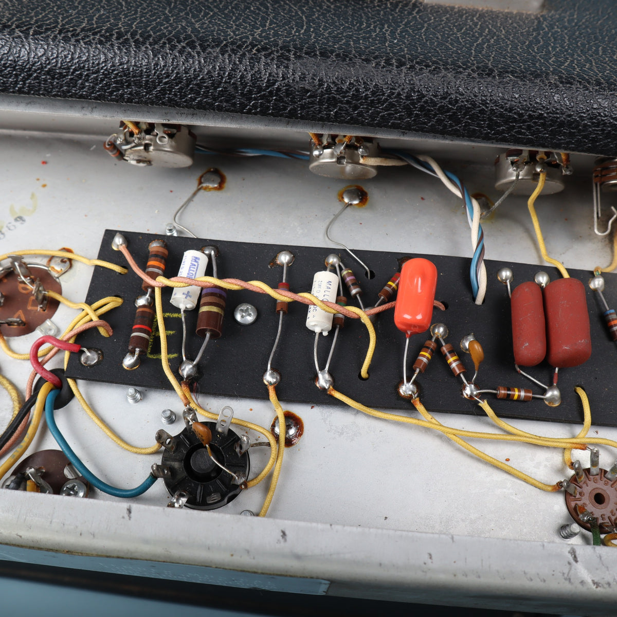Circuit board components and power wiring inside the amplifier chassis.