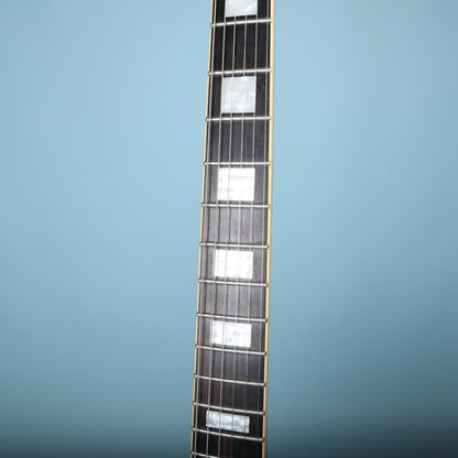 Close-up of Epiphone Les Paul Custom fretboard with pearloid block inlays