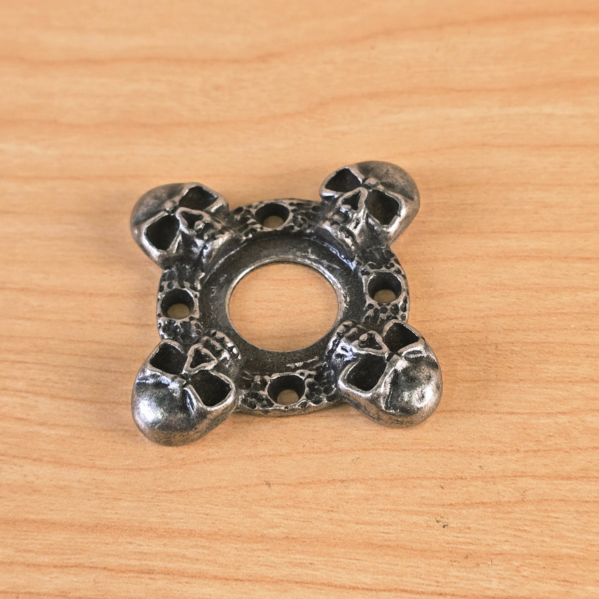 Front diagonal view of skull motif guitar part
