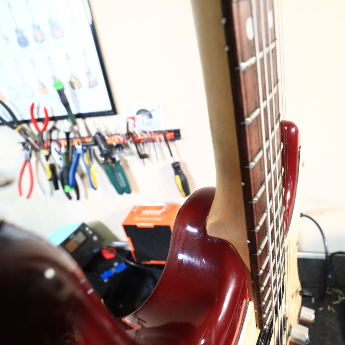 Rear body edge view showing tremolo cover plate and minor finish scuffs.