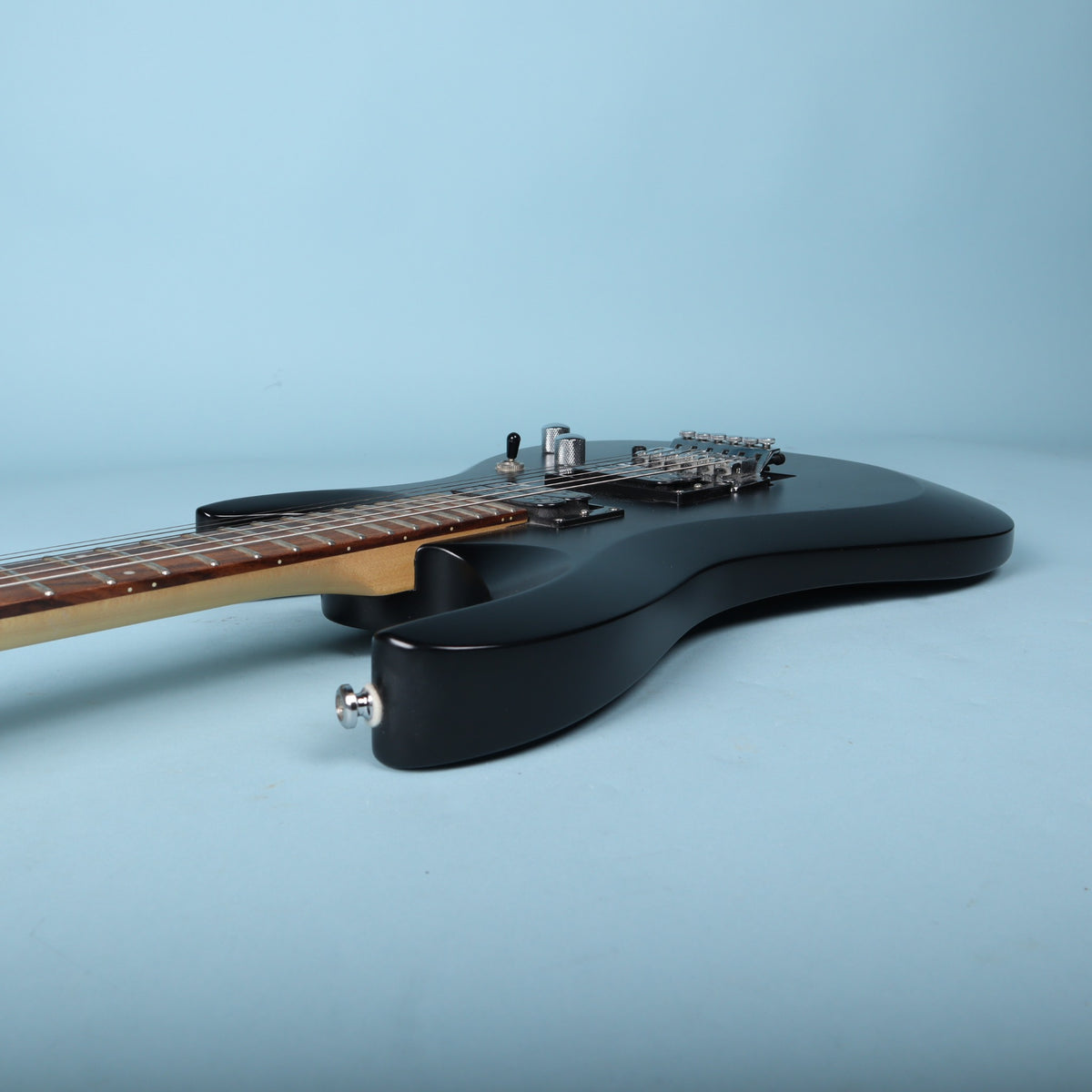 Treble side edge profile of the contoured guitar body and neck.