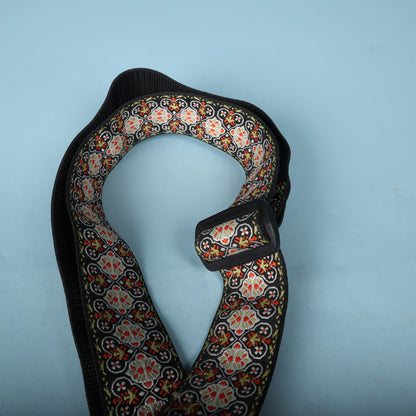 Overhead view of the looped Ernie Ball jacquard strap highlighting the Delrin adjustment buckle