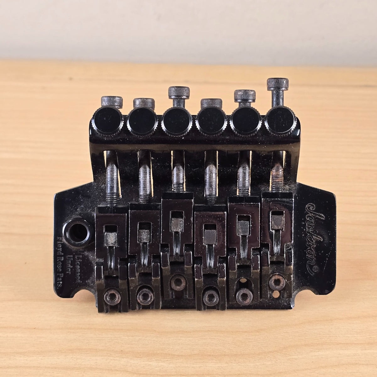 Top view of Jackson licensed Floyd Rose tremolo bridge in black