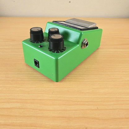 Angled view showing the top controls and left side 1/4-inch output jack of the Ibanez TS9.