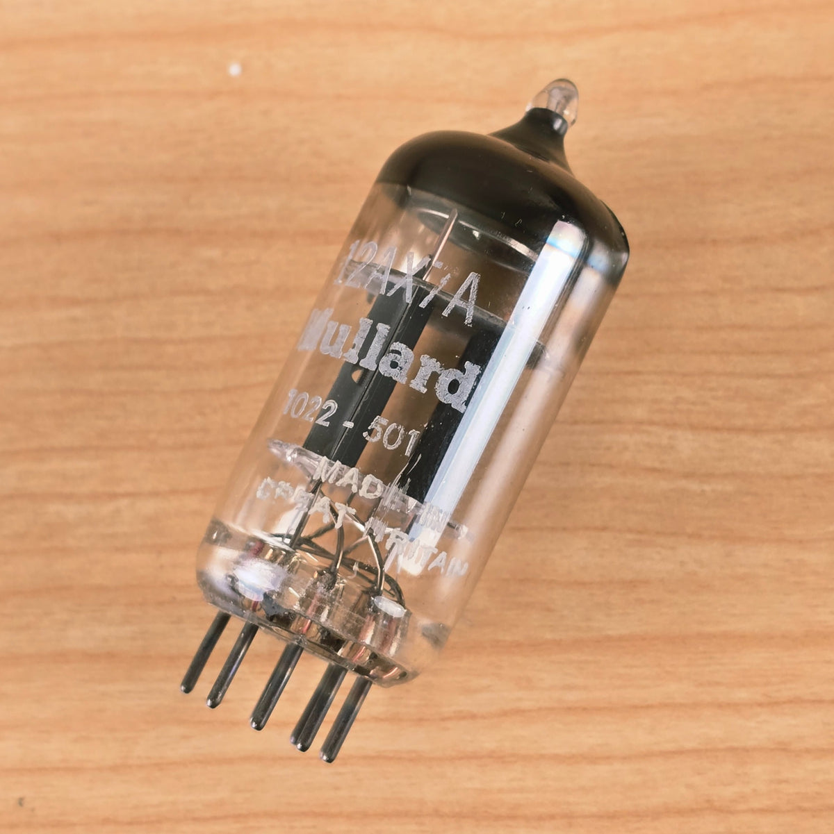 Angled side profile of Mullard 12AX7A vacuum tube.