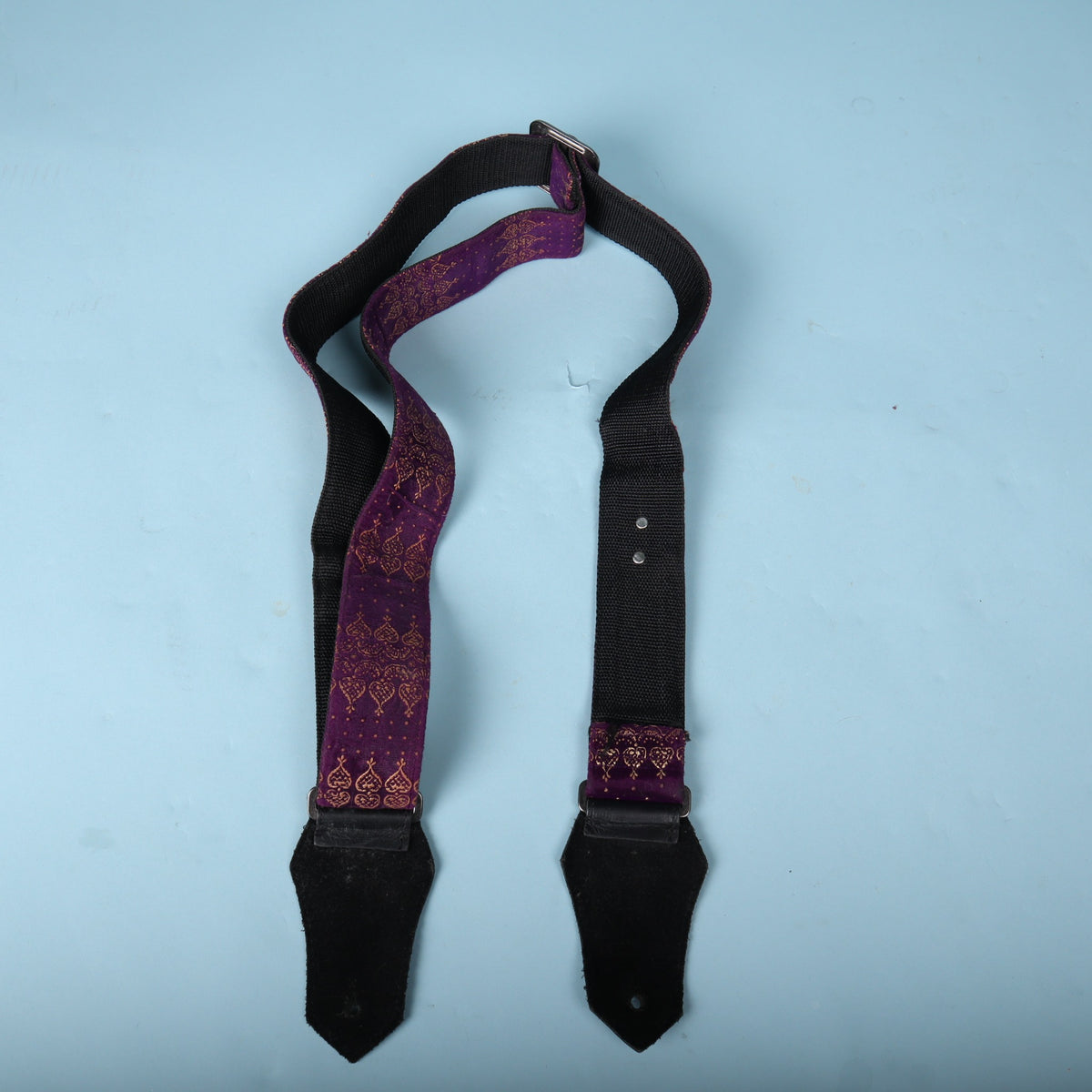 Full rear view of the Get'm Get'm Indochine strap showing black webbing backing