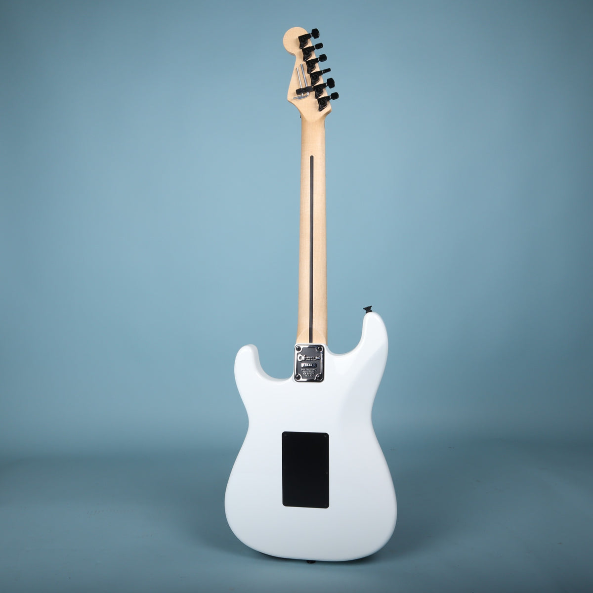 Full rear view of white Charvel Custom Shop guitar.