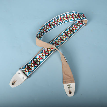 Wide view of the complete Authentic Hendrix strap laid out with both white leather ends visible