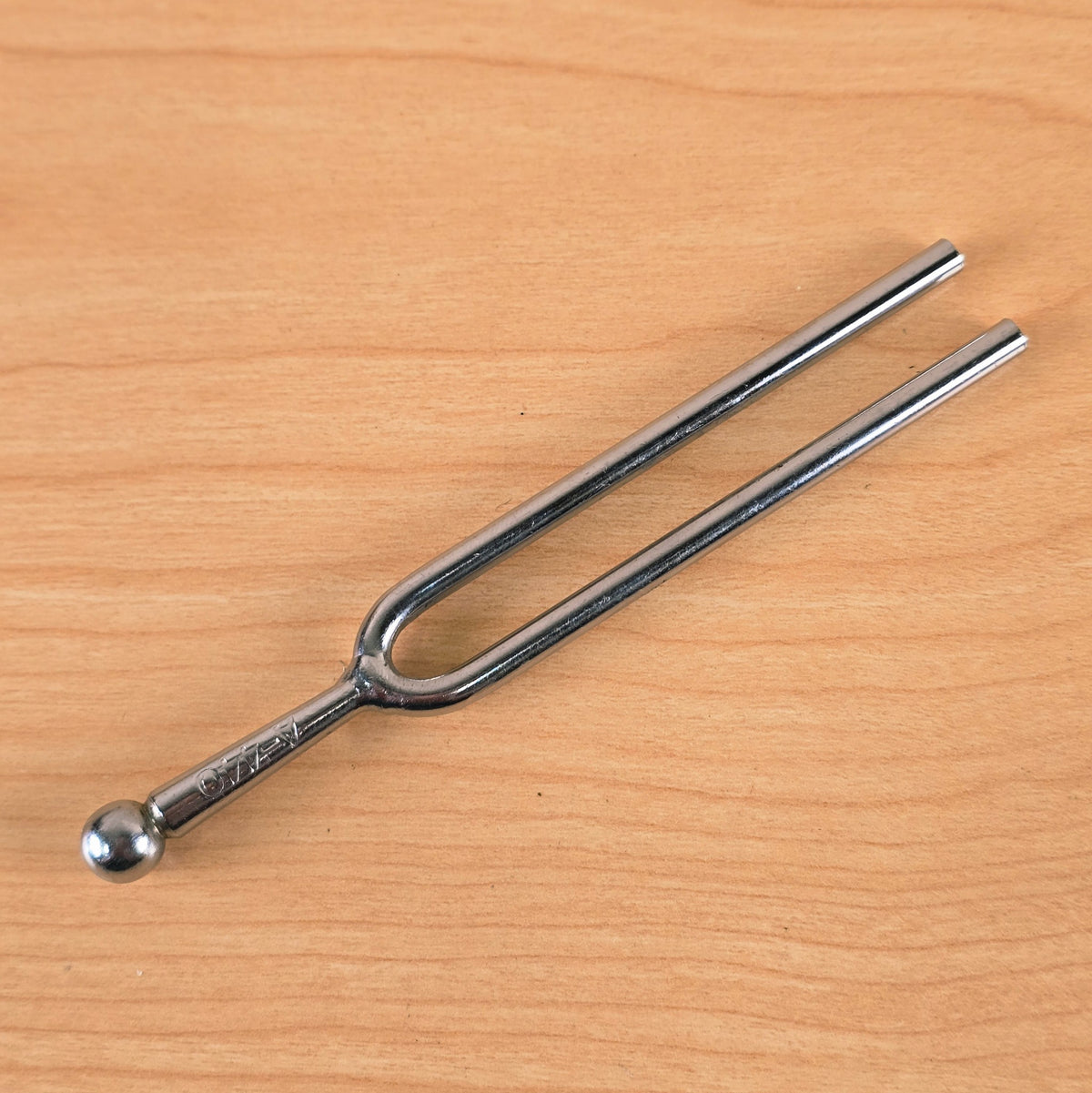 Full length view of the reverse side of the A-440 Hz tuning fork