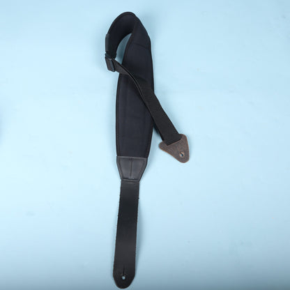 Full view of the Neotech black padded strap laid out on a blue background.