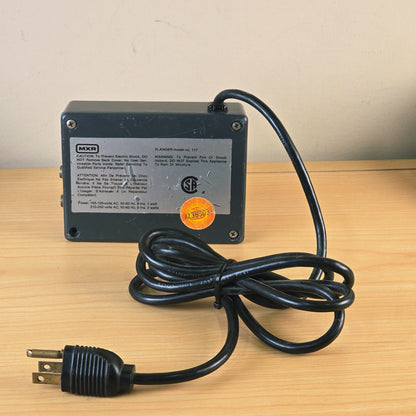 Rear label of MXR Flanger Model 117 showing power specifications and CSA logo.